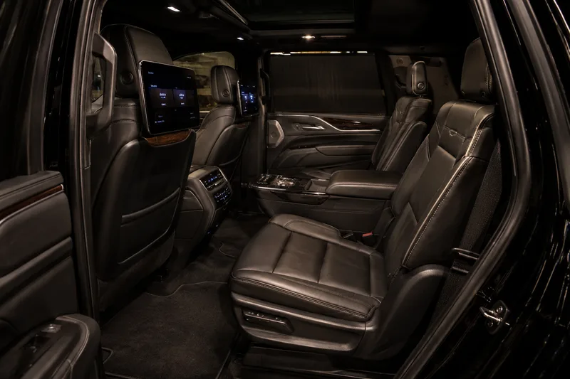 Black Cadillac Escalade ESV — rear three-quarter
