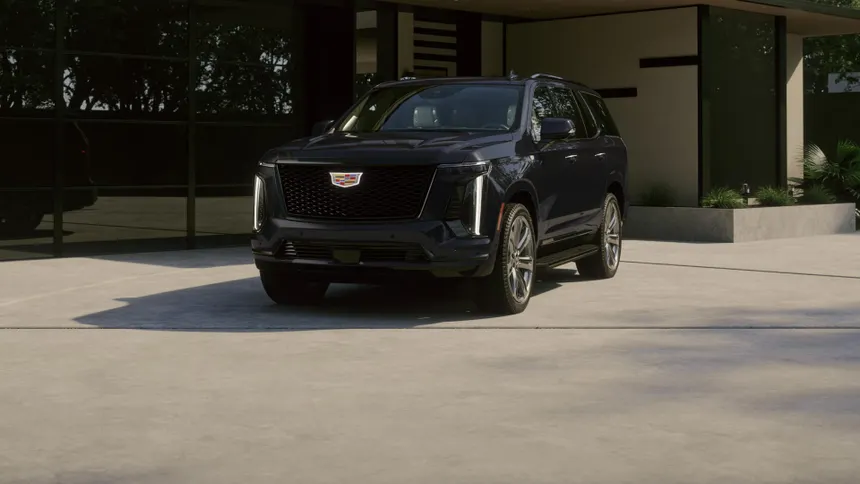 Black Cadillac Escalade ESV — front three-quarter view